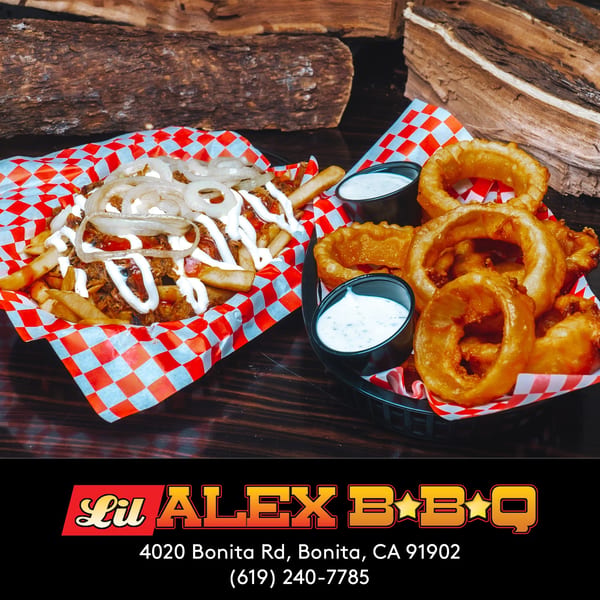 Lil Alex BBQ's loaded fries with onions and sauce, alongside crispy onion rings with dipping sauce.