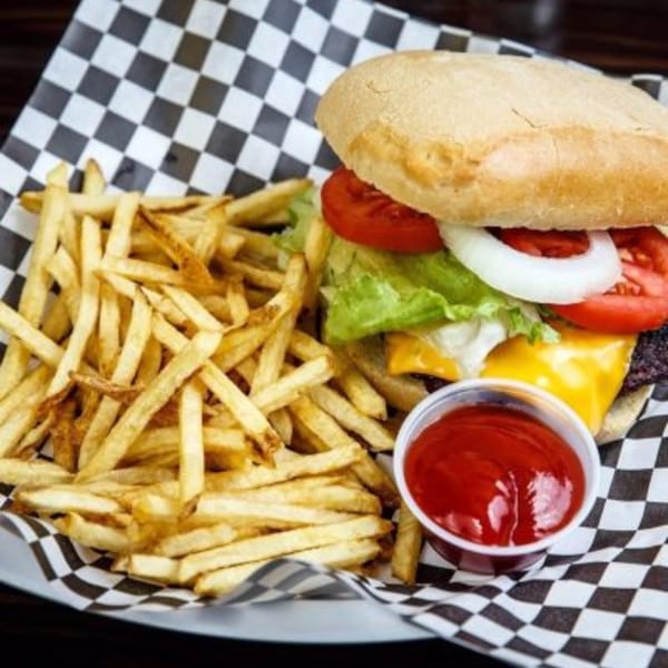 A Lil Alex BBQ cheeseburger with lettuce, tomato, and onion, served with fries and ketchup.